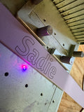 custom engraving "sadie" added to a lavendar collar