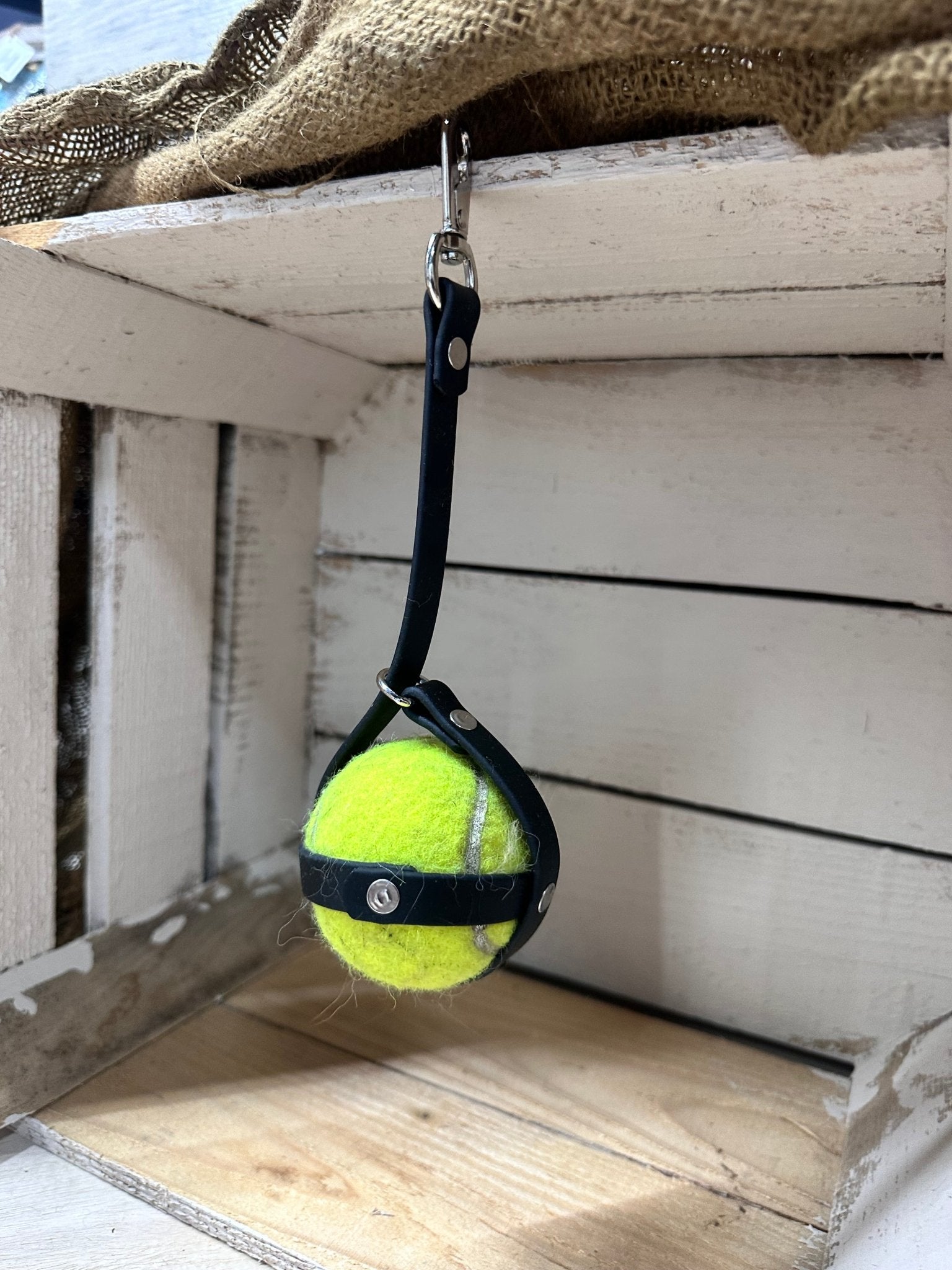 Picture of ball sack tennis ball holder with a tennis ball inside